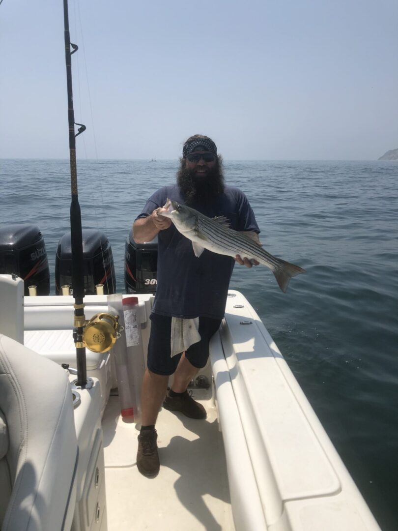 A Man With A big Beard Holding a Big Fish