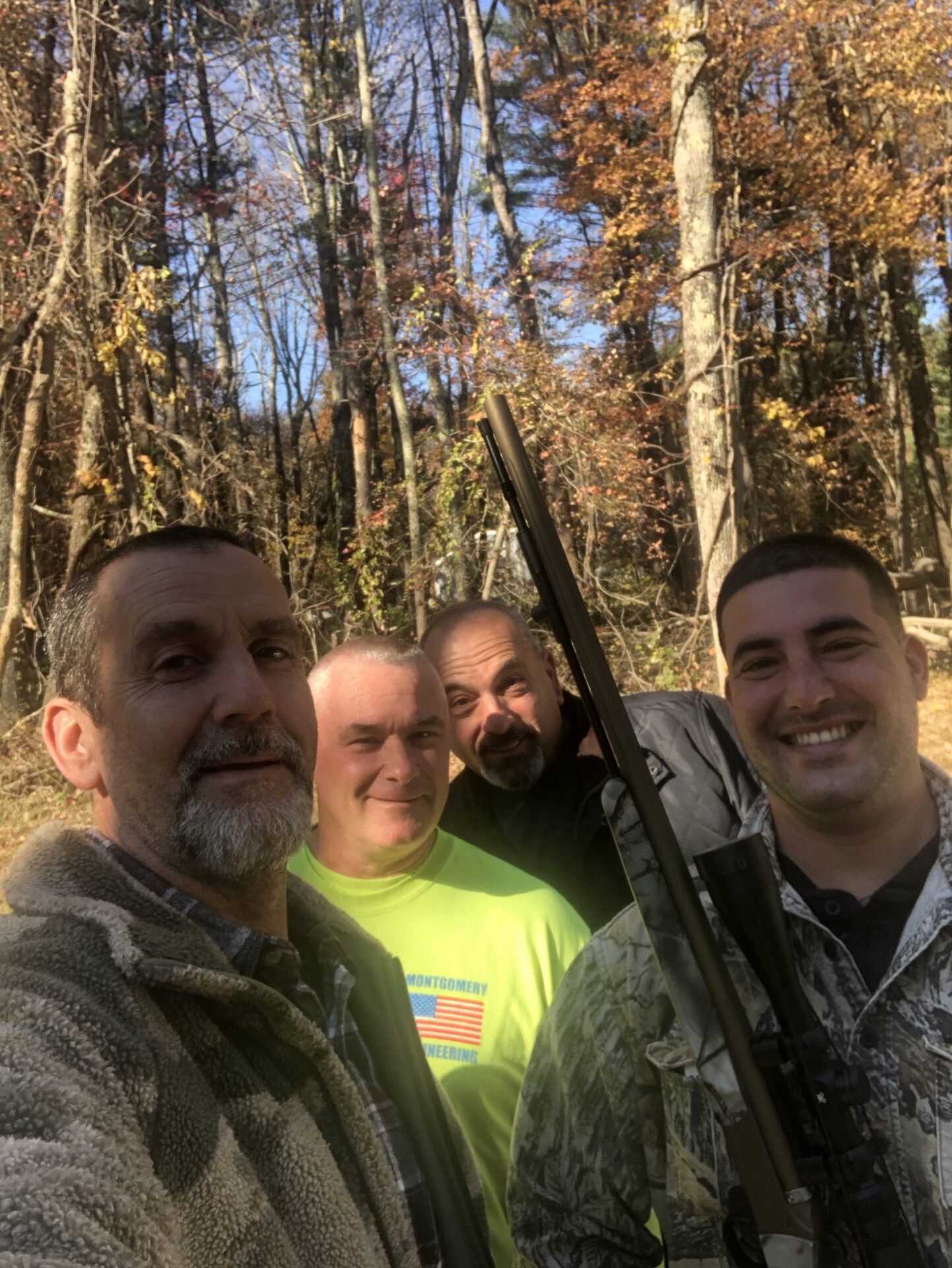 Four Men Taking a Picture in the Middle of the Woods