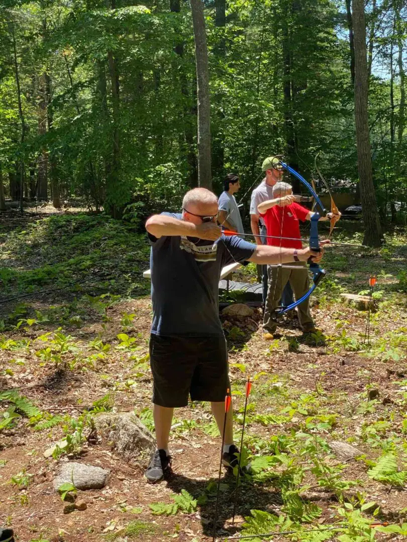 Two people simultaneously practicing archery